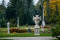 English-style park with terraces in autumn day, rose garden, statues near romantic medieval gothic and baroque castle Konopiste,