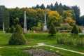 English-style park with terraces in autumn day, rose garden, statues near romantic medieval gothic and baroque castle Konopiste,