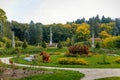 English-style park with terraces in autumn day, rose garden, statues near romantic medieval gothic and baroque castle Konopiste,