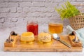 English style scones delicious freshly baked homemade, strawberry jam on a wooden tray with a cloth and a teacup with a Royalty Free Stock Photo