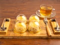 English style scones delicious freshly baked homemade on wooden tray and teacup on wooden table. Royalty Free Stock Photo