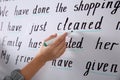 English teacher underlining word on whiteboard at lesson, closeup