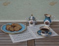 English teacup with saucer, sugar bowl, cream jug and a cake plate with cookies, fine bone china porcelain, on a sheet of music