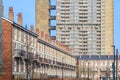 English terraced houses in contrast to council housing block in Royalty Free Stock Photo