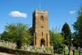 English village church with tower and cemetery Royalty Free Stock Photo