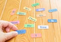 English word cards on wooden table in class