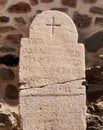 Engraved inscriptions on historical cracked Orthodox marble tombstone Royalty Free Stock Photo