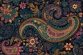 Engraved paisley patterns in vibrant colors on a dark background