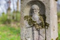 Engraved sculpture of saint on grave