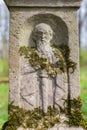 Engraved sculpture of saint on grave