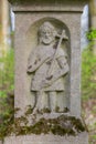 Engraved sculpture of Saint John the Baptist on grave