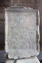 Engraved stone in Coliseum with latin letters Royalty Free Stock Photo