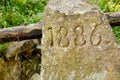 1886 engraved on stone