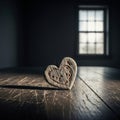 An engraved wooden heart standing on a scratched table. Royalty Free Stock Photo