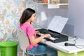 Young girl playing music on an electronic keyboard Royalty Free Stock Photo