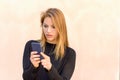 Engrossed young woman reading a text message Royalty Free Stock Photo