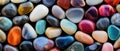 Enhance your design with this abstract background featuring a texture of colorful polished pebbles and stones, a harmonious and Royalty Free Stock Photo