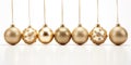 Golden baubles in a line - Christmas ornaments - Xmas decoration - White Background