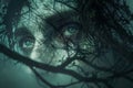 Enigmatic Woman\'s Face Partially Obscured by Silhouetted Tree Branches, Dark Atmospheric Mystical Concept
