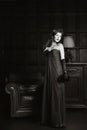 Enigmatical woman in home interior in bw Royalty Free Stock Photo