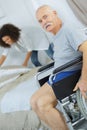 Enior man in wheelchair in retirement house Royalty Free Stock Photo