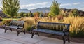 Enjoy the Beauty of a Park with Metal Benches, Overlooking Residential Areas Against a Mountainous Skyline Royalty Free Stock Photo