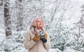 Enjoy beauty of snow scenery through photos. Woman photographer with professional camera. Enjoy enchanting paleness and