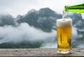 Enjoy beer with mountain landscape.