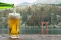 Enjoy beer with mountain landscape beside Lake Ashi Hakone in Japan.