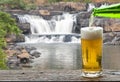 Enjoy beer with waterfall landscape.