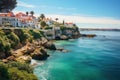 Enjoy a breathtaking view of a beach adorned with picturesque houses nestled atop majestic cliffs., Scenic view in Cascais, Lisbon