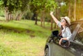 Enjoy Car travel of woman driving with sunglasses journey at nature forest Royalty Free Stock Photo