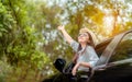 Enjoy Car travel of woman driving with sunglasses journey at nature forest Royalty Free Stock Photo