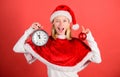 Enjoy celebration happy new year. Girl happy wear santa costume celebrate christmas hold ball decor red background Royalty Free Stock Photo