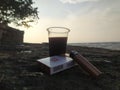 Enjoy coffee and cigarete on the beach Royalty Free Stock Photo