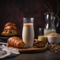 Creamy and nutty Soy Milk in a tall glass with sweet pastries on table