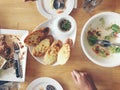 Enjoy eating. Top view of friends, family, group of people have eating healthy food together after vegetarian cooking classes whil Royalty Free Stock Photo