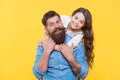 Enjoy fathers day. Happy family celebrate fathers day. Little daughter hug father. Small child and bearded man yellow