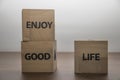 Enjoy good life, positive inspirational messages on wooden cubes