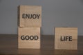 Enjoy good life, positive inspirational messages on wooden cubes