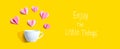 Enjoy the little things message with a coffee cup and paper hearts Royalty Free Stock Photo