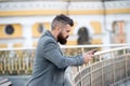 Enjoy mobile phone services here. Bearded man email or sms from smart phone. Mobile blogging. Communication technology Royalty Free Stock Photo