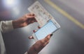 Enjoy railroad transport concept.Pretty woman using smartphone while standing in train station. Horizontal closeup. Royalty Free Stock Photo