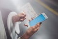 Enjoy railroad transport concept.Pretty woman using smartphone while standing in train station. Horizontal closeup. Royalty Free Stock Photo