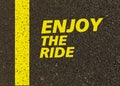 Enjoy the ride written on the road. Royalty Free Stock Photo