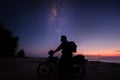 Enjoy riding bike under the milkyway during twilight Royalty Free Stock Photo