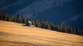 Distant view of a little house nestled in the mountains