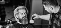 enjoy the services. Hair care and male grooming concept. get perfect shape. bearded man getting beard haircut by barber