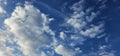 Beautiful billowing clouds (cumulus) in the deep blue sky.