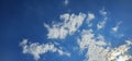 Beautiful billowing clouds (cumulus) in the deep blue sky.